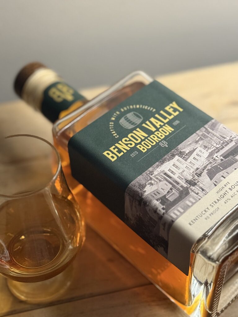 Benson Valley High Rye Bourbon 90 Proof lying with glencairn glass