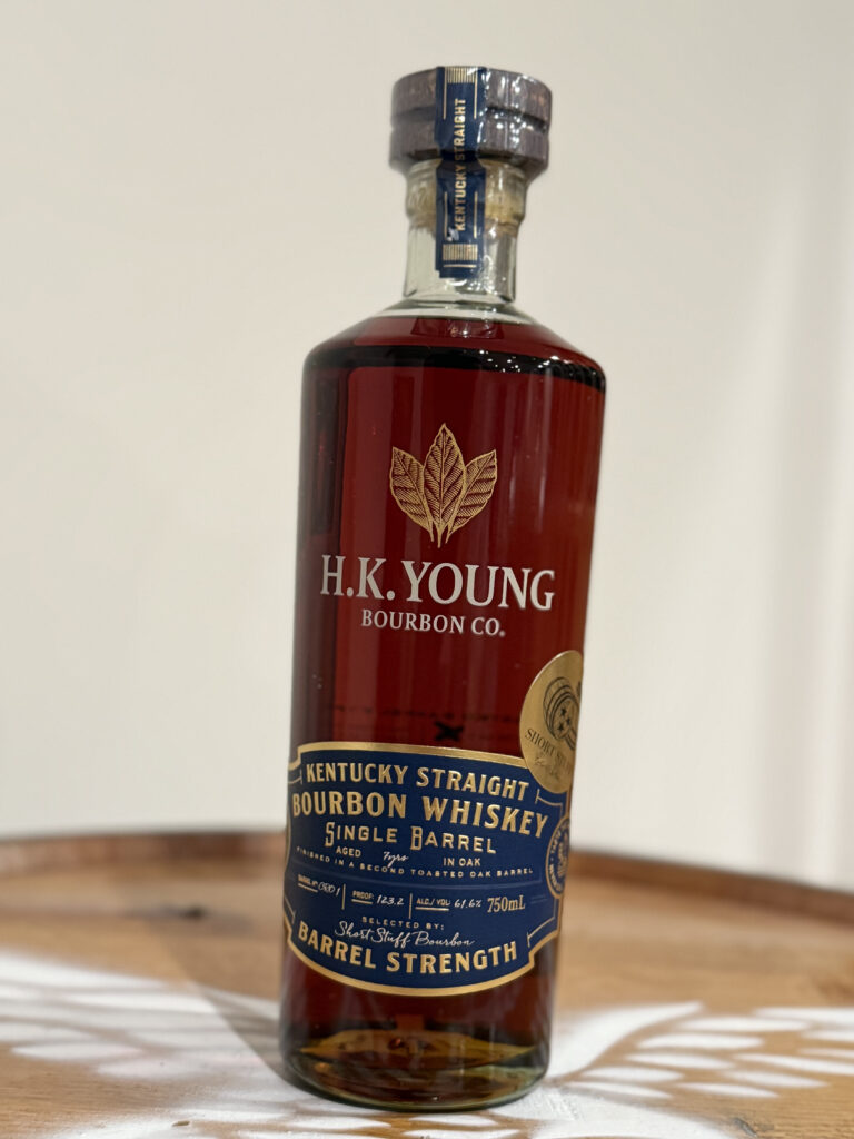 H.K. Young High Rye Toasted Bourbon Shortstuff Bourbon Single Barrel (123.2 Proof) Pick sitting on whiskey barrel.
