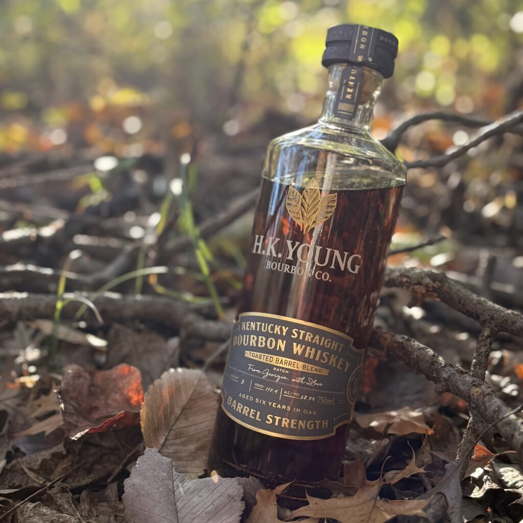 HK Young Toasted Barrel Blend #3 From Georgia with Love in forest lit by sunlight