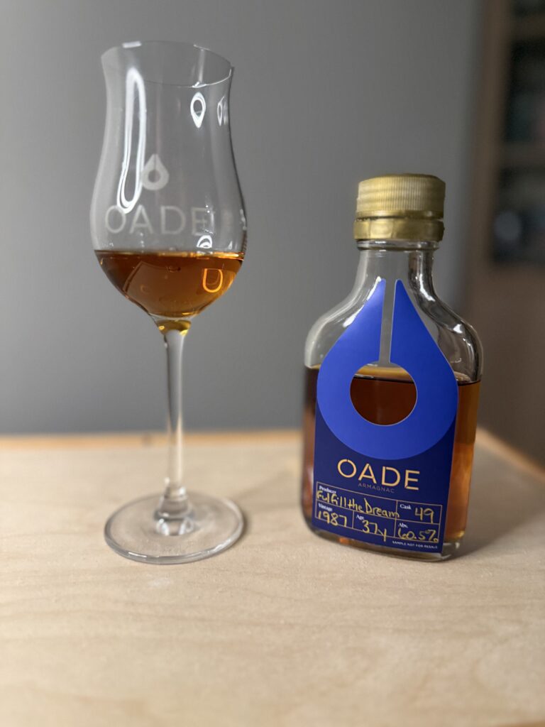 Oade Armagnac Fulfill The Dream sample beside Oade tasting glass