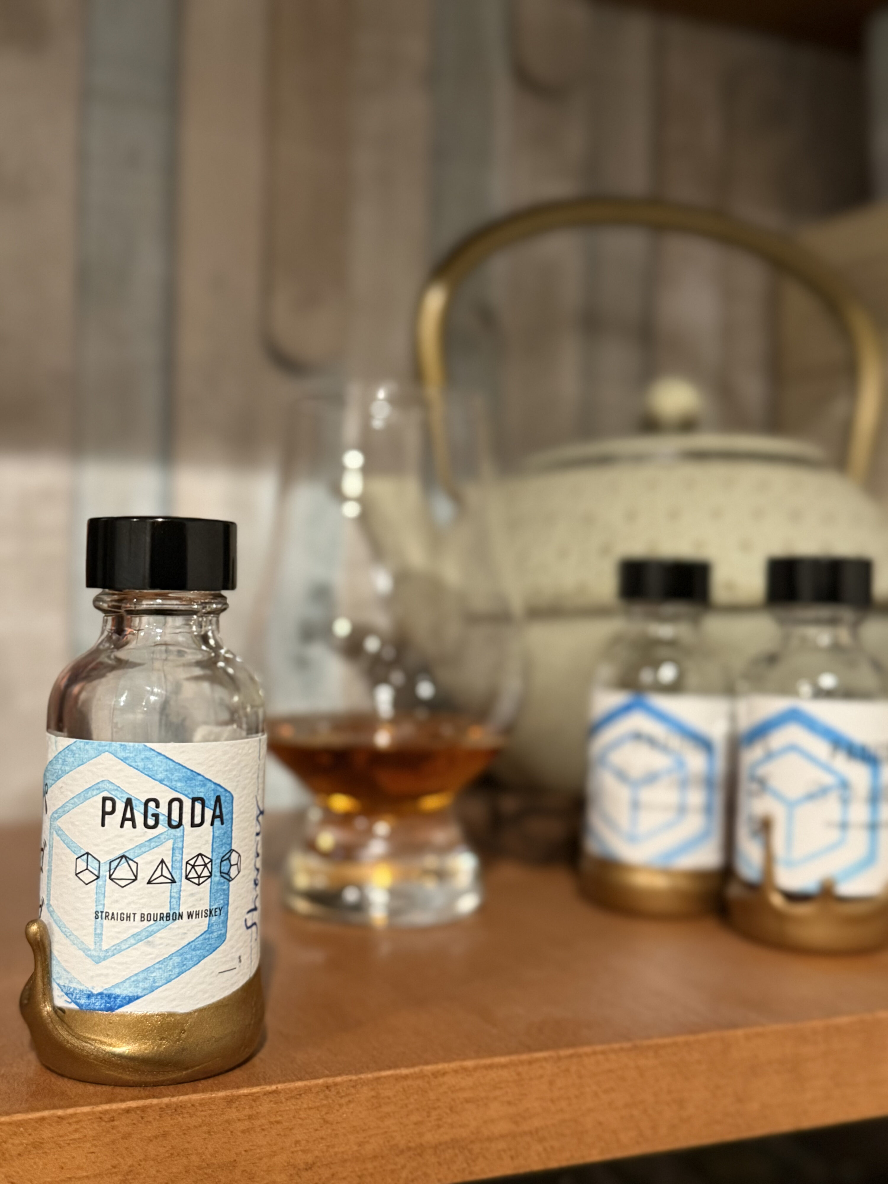 Pagoda finished bourbon samples on shelf with medium blur