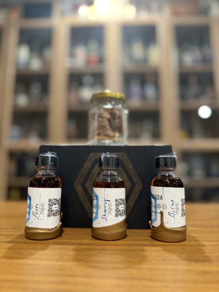 Pagoda porto, birne, and sherry finished bourbon samples and pecans on desk