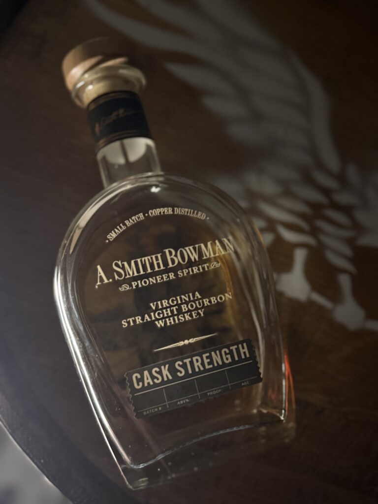 A. Smith Bowman Cask Strength Batch 3 lying on whiskey barrel
