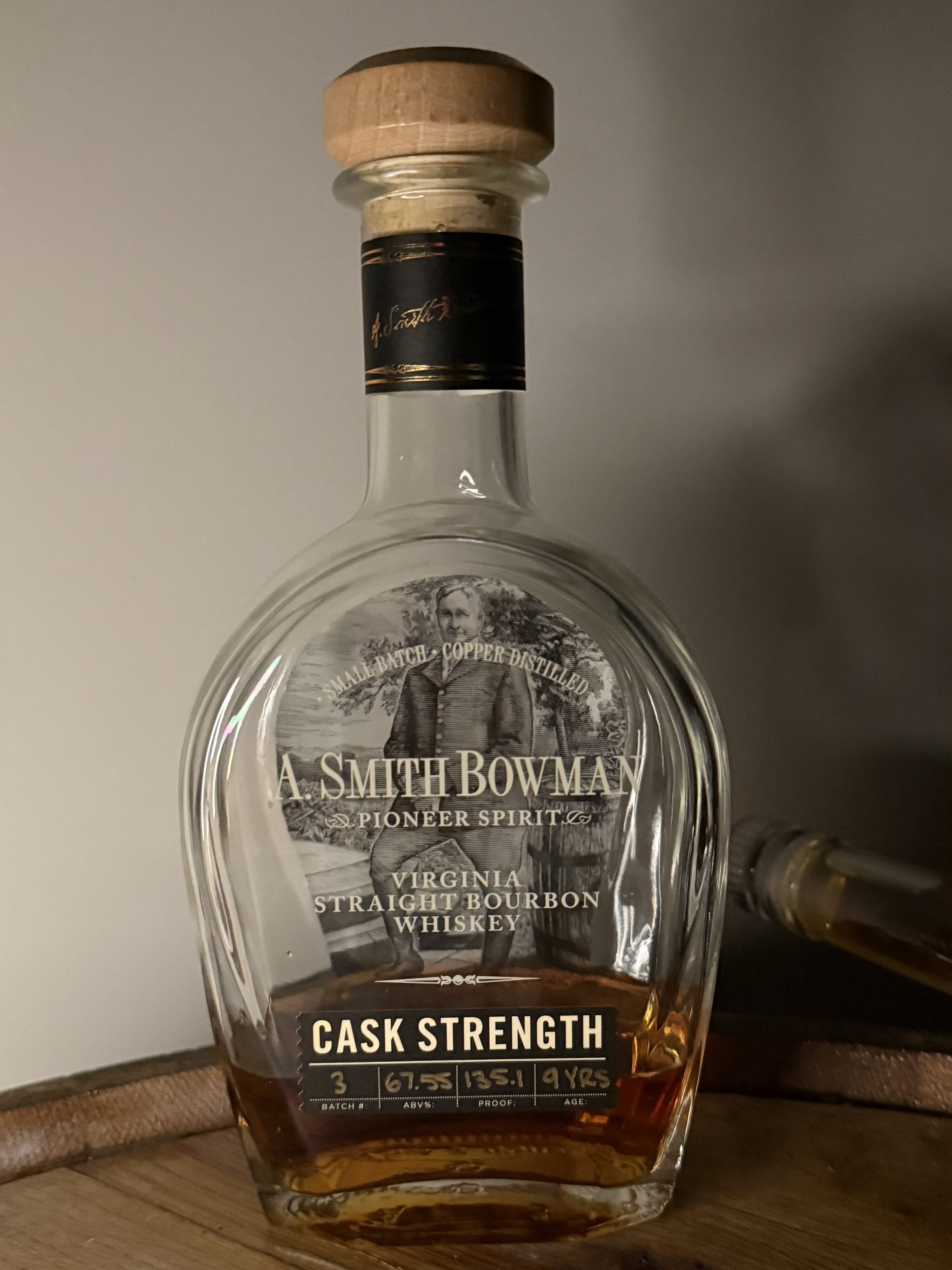 A. Smith Bowman Cask Strength Batch 3 standing up on whiskey barrel