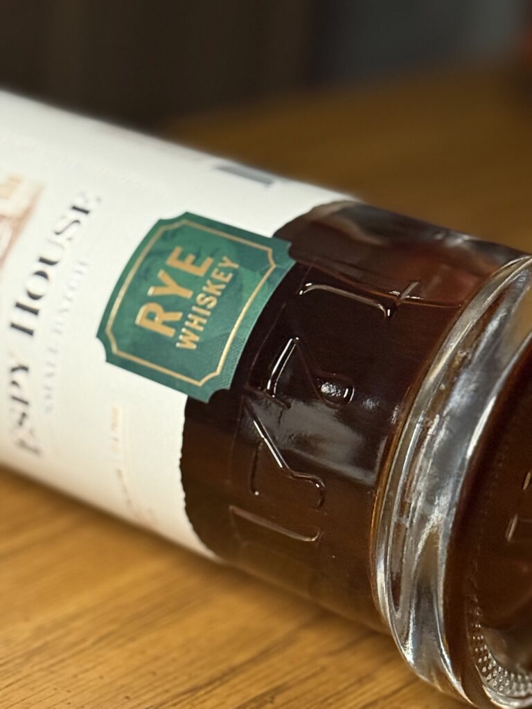 Espy House Rye closeup of glass embedded 1771 and low part of label showing "rye whiskey"