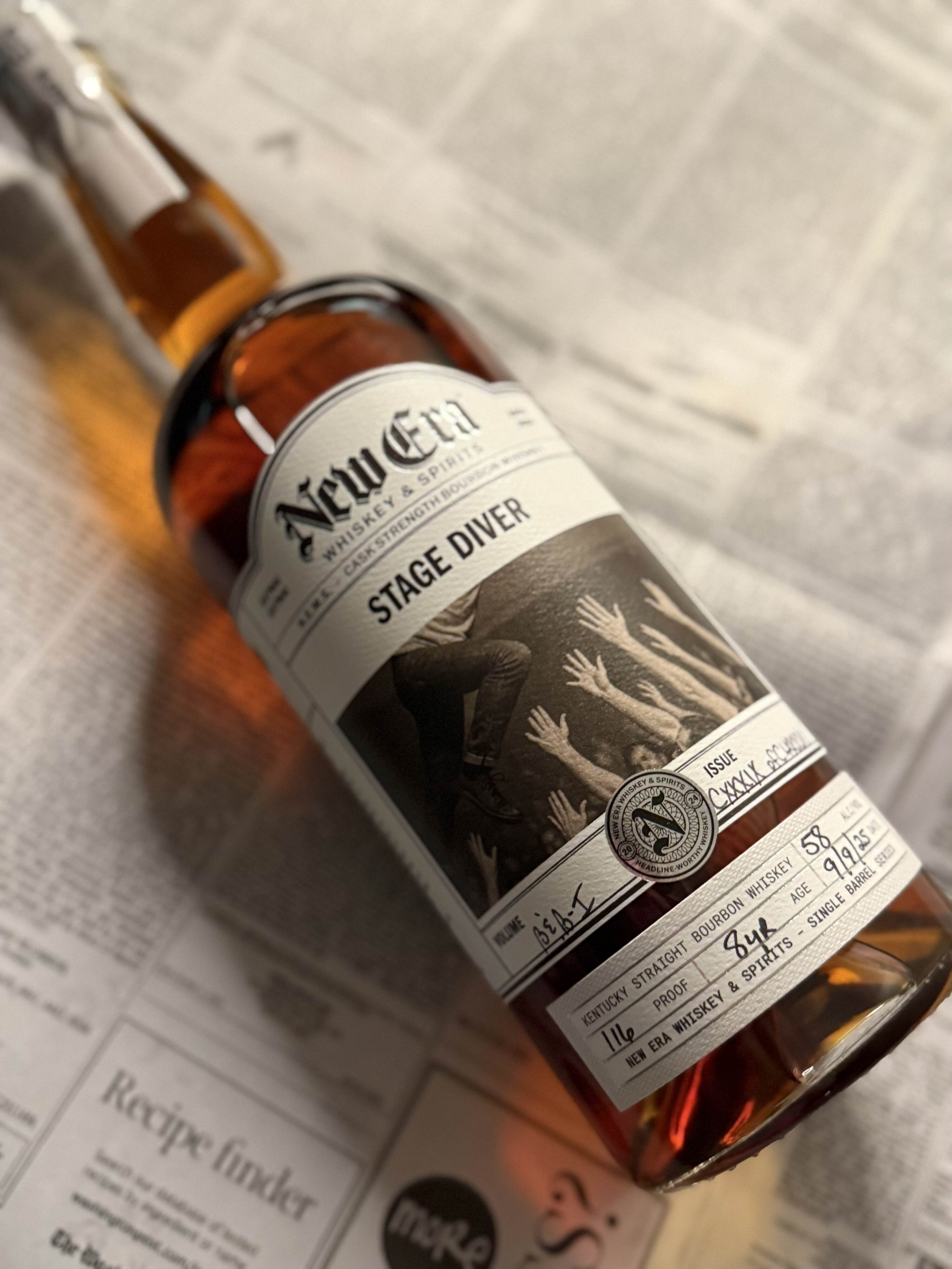 New Era Stage Diver Single Barrel zoomed in lying on black and white newspaper