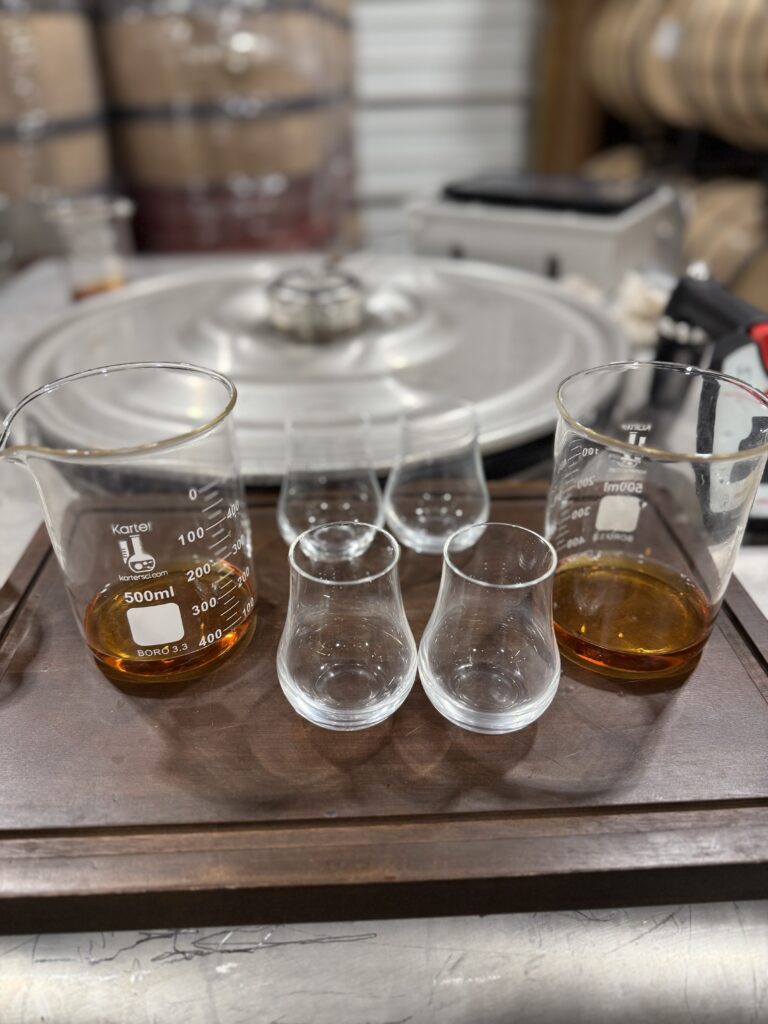 Final two rye blends in beakers with ready tasting glasses
