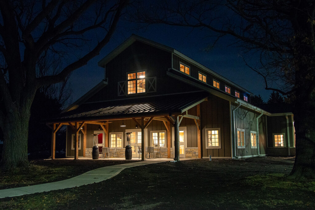 Whiskey Acres Tasting Room from outside lit up at night