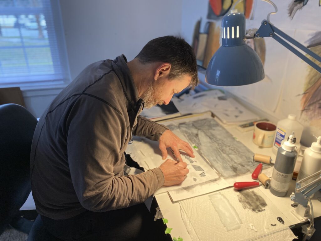 Artist Mark Todd working on the VA 250 Trio artwork