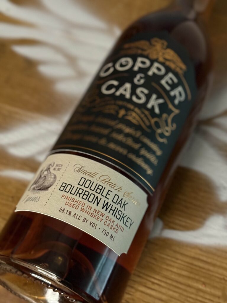 Copper & Cask Double Oaked Small Batch Series 07 front label lying on whiskey barrel