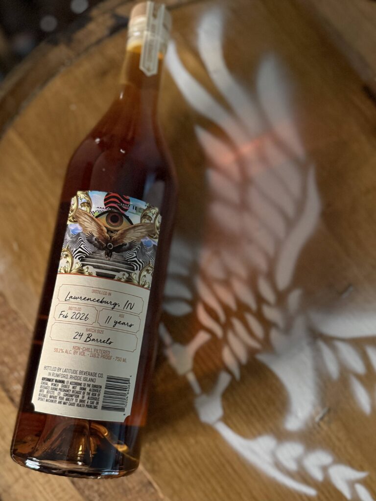 Copper & Cask Small Batch Series 16 back label against whiskey barrel with eagle logo