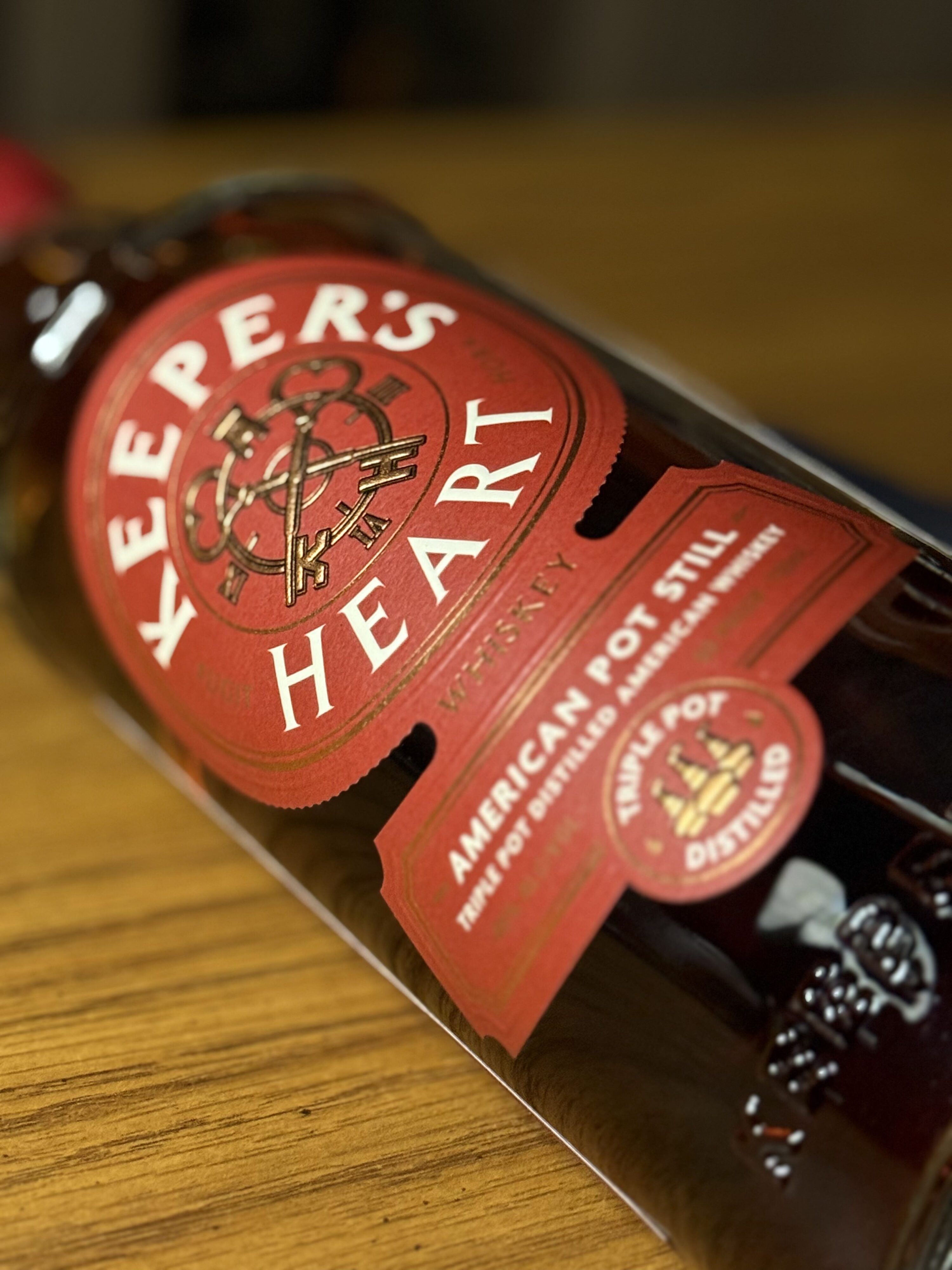 Keeper's Heart American Pot Still Whiskey close-up lying on side