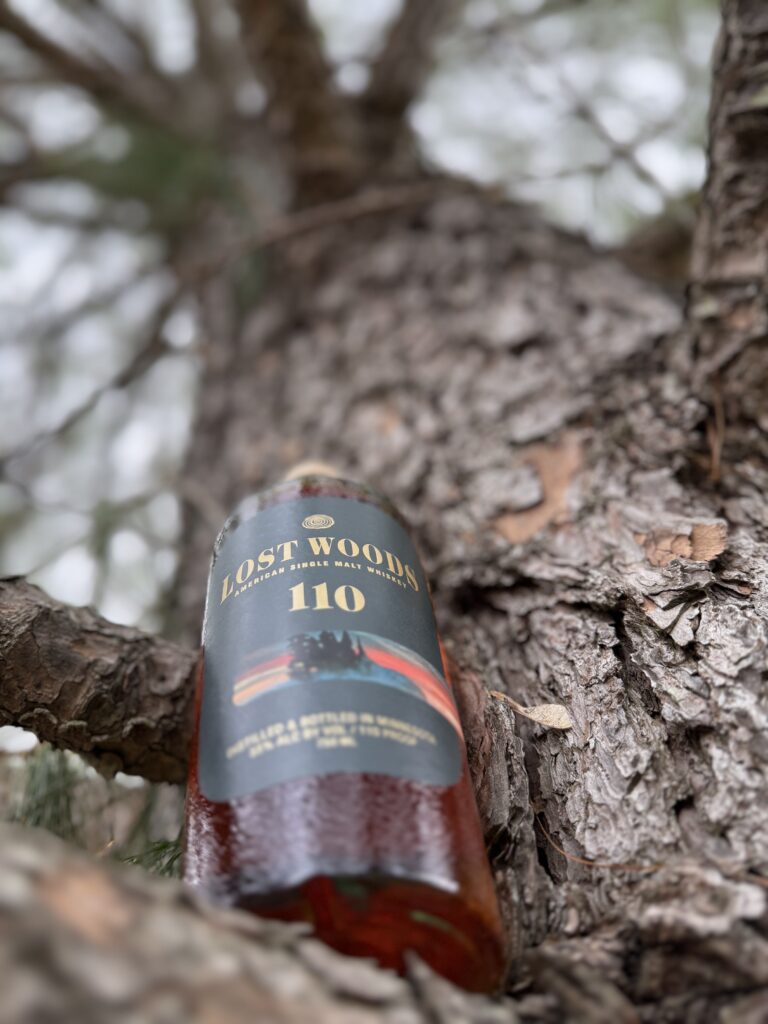 Lost Woods 110 Proof Cask Strength ASM from below looking into branches of large tree