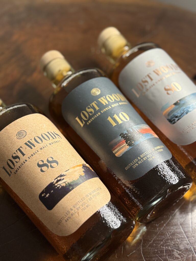 Lost Woods American Single Malt Lineup from angle, Left to Right: 88 Proof, 110 Proof Cask Strength, 80 Proof