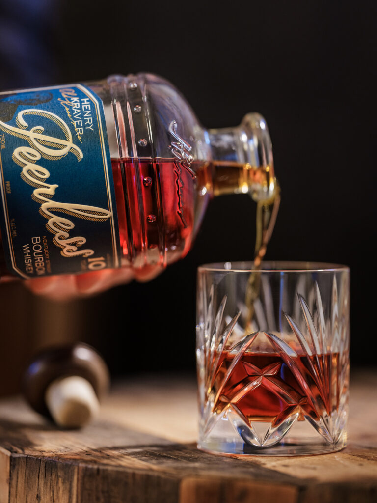Peerless Henry Kraver 10 Year Release pouring into whiskey rocks glass