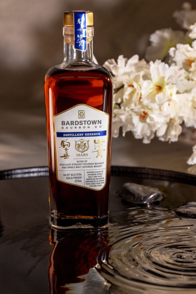 Bardstown Bourbon Company's Distillery Reserve Mars Blend beside blooms