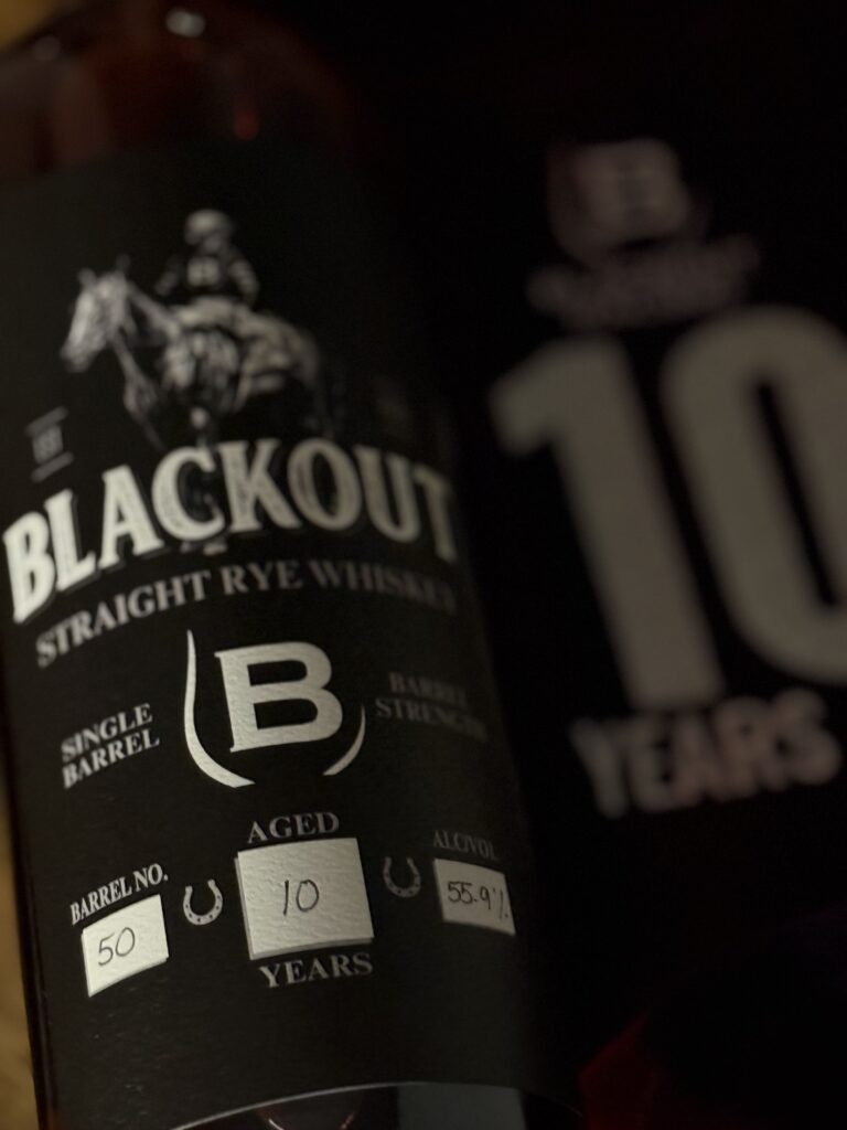 Blackout 10 Year Cask Strength Single Barrel Rye close-up label beside 10 year bag.