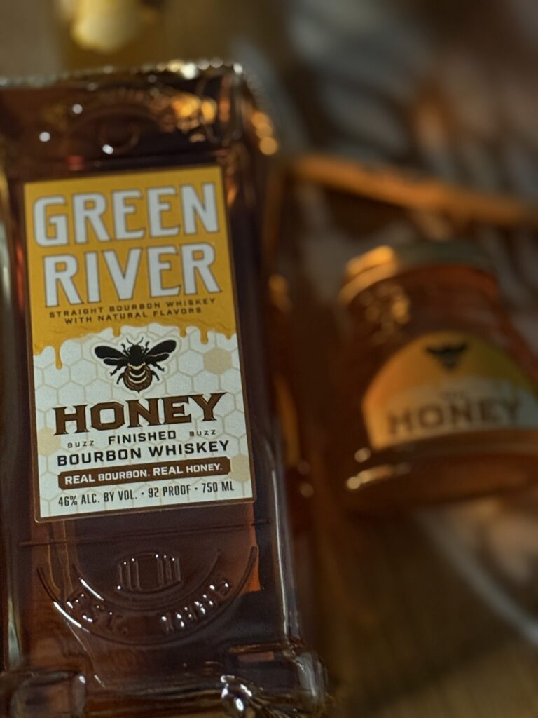 Green River Honey Bourbon lying beside real honey