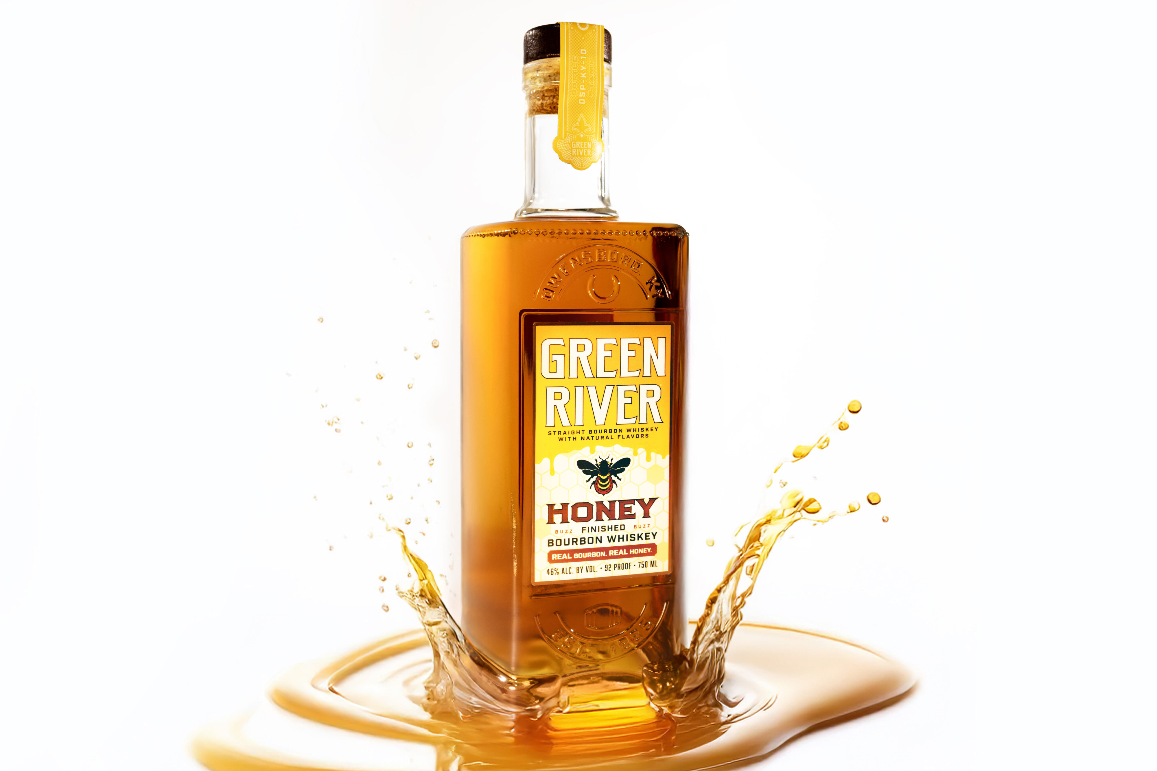 Green River Honey Bourbon splashing into pool of honey