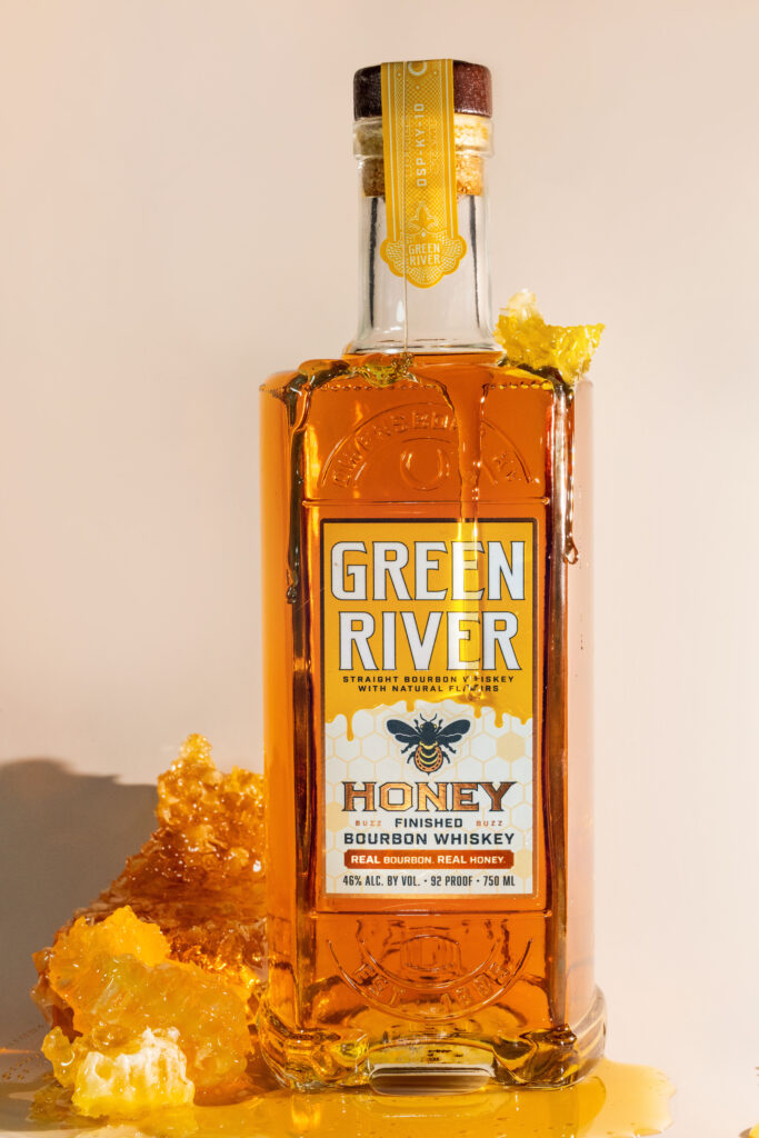Green River Honey Bourbon standing honeycomb beside it