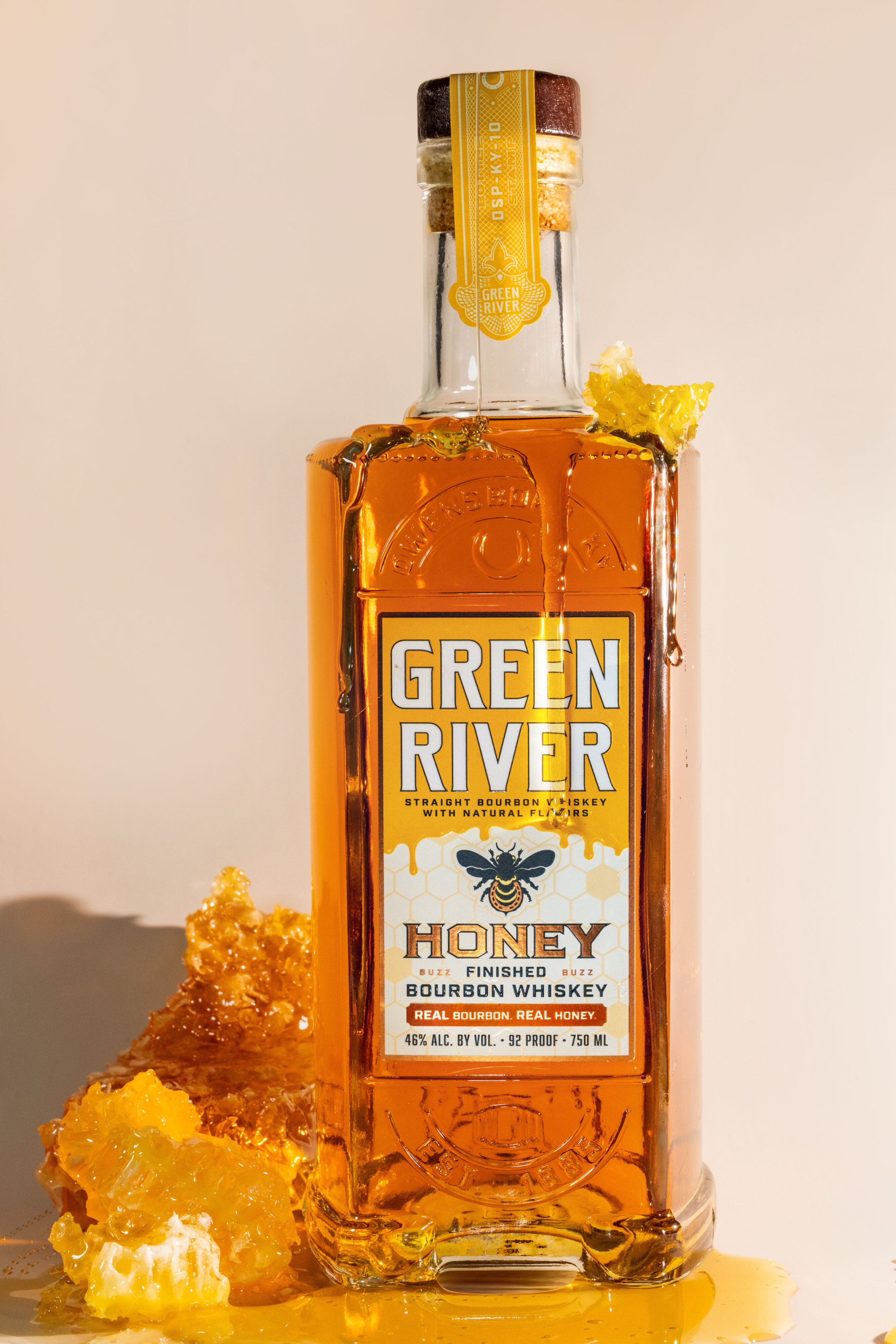 Green River Honey Bourbon standing honeycomb beside it