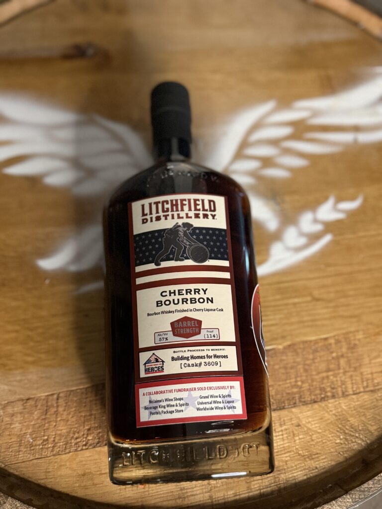 Litchfield Cherry Bourbon lying on Eagle whiskey barrel