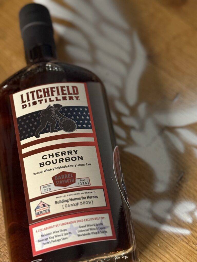 Litchfield Cherry Bourbon lying beside eagle logo