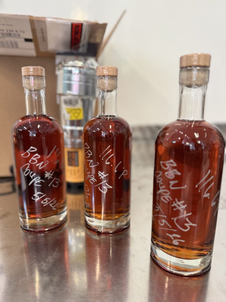 The final blend, bottled, labeled and signed by Ethan, Michael & Kirby