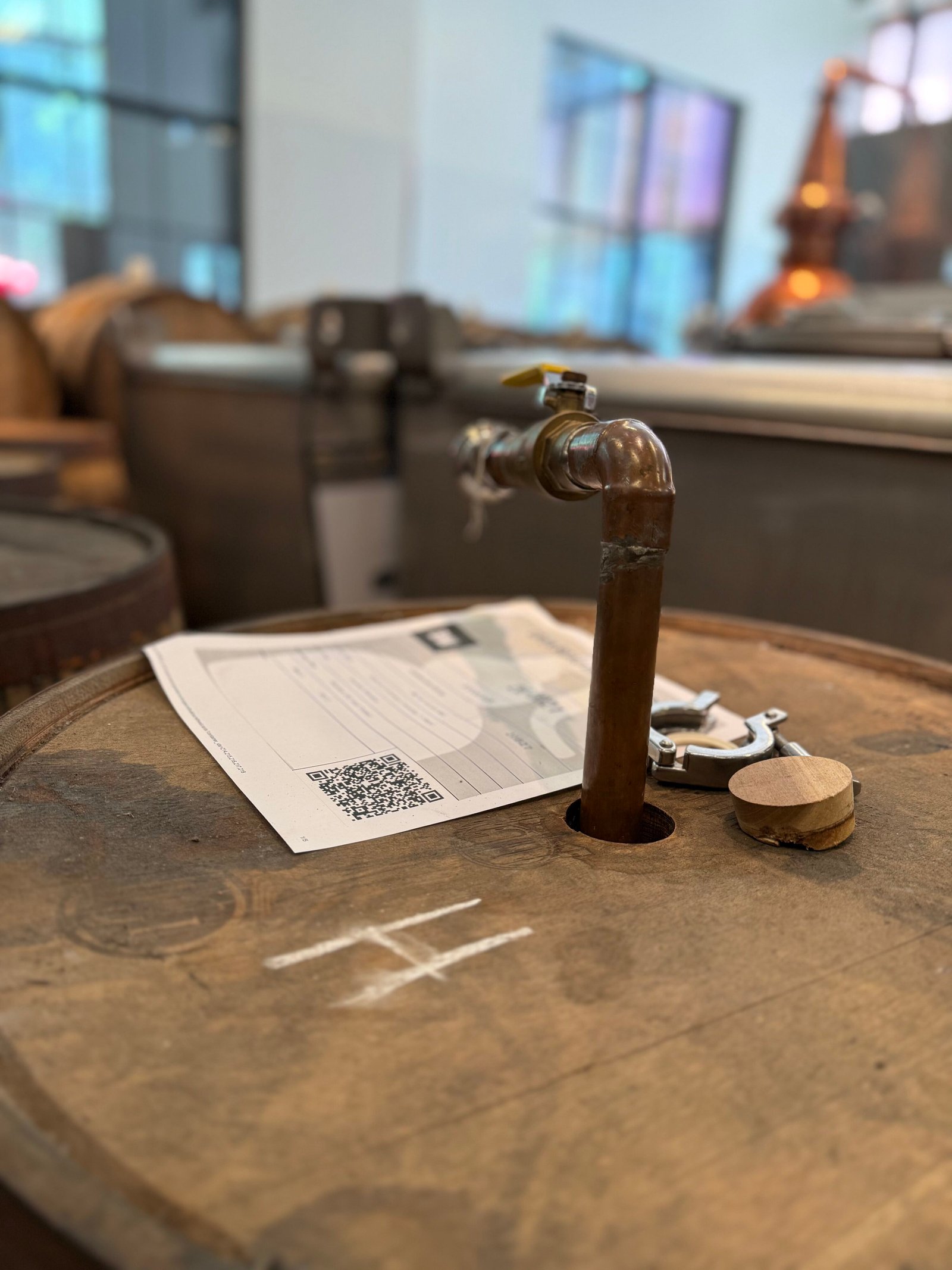 Pump pipe placed into barrel to bring the whiskey across the room to the blending vat