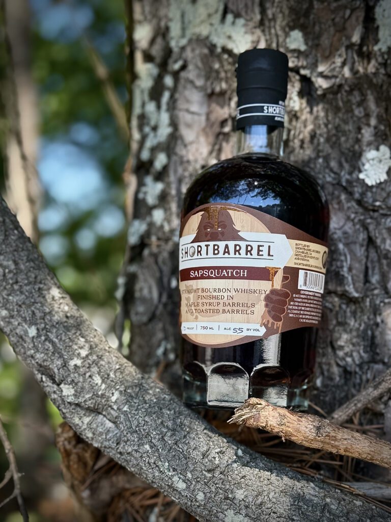 Shortbarrel Sapsquatch on branch against tree