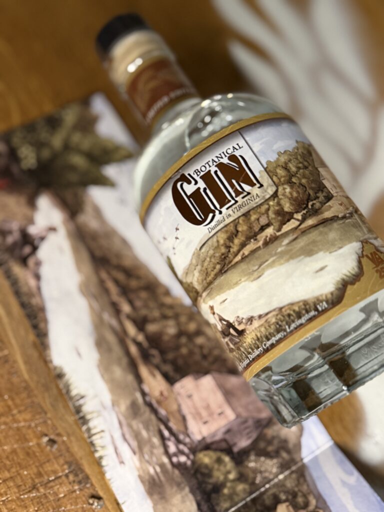 VA 250th Trio Gin lying beside pullout artwork