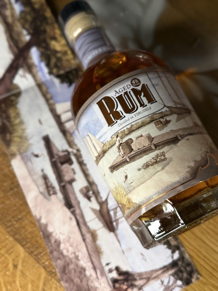 VA 250th Trio Rum lying beside pullout artwork