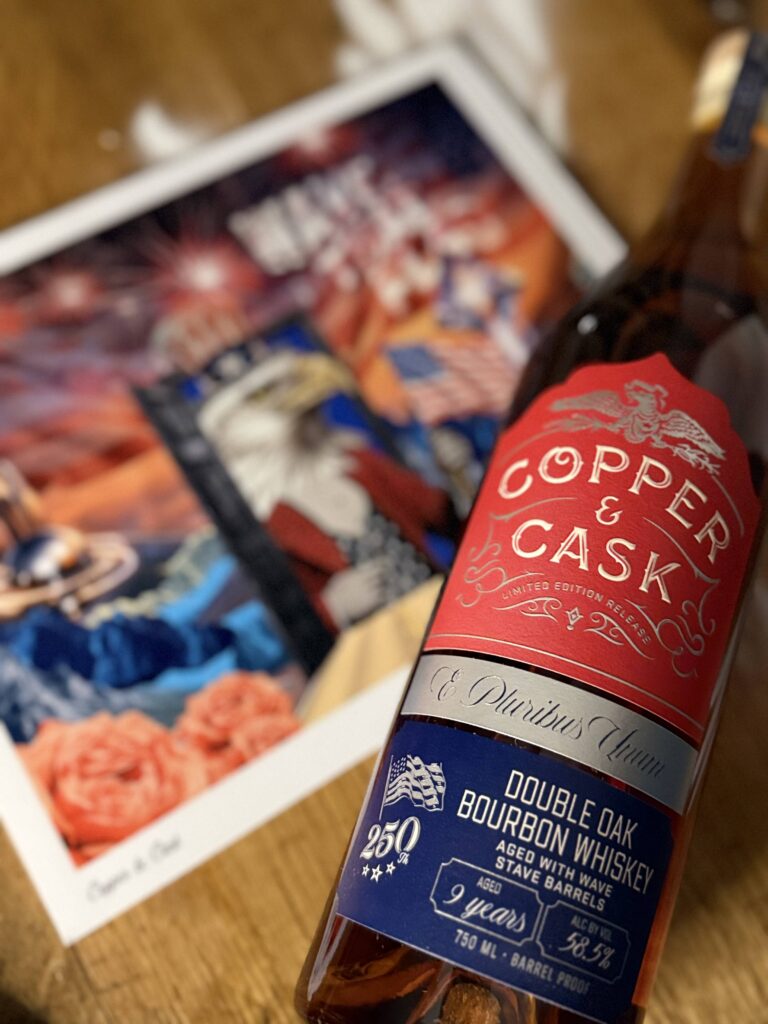 Copper & Cask "Wave That Flag" lying beside blurred accompanying Wave That Flag art print