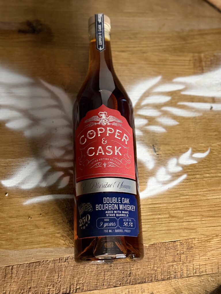 Copper & Cask "Wave That Flag" lying on eagle barrel head