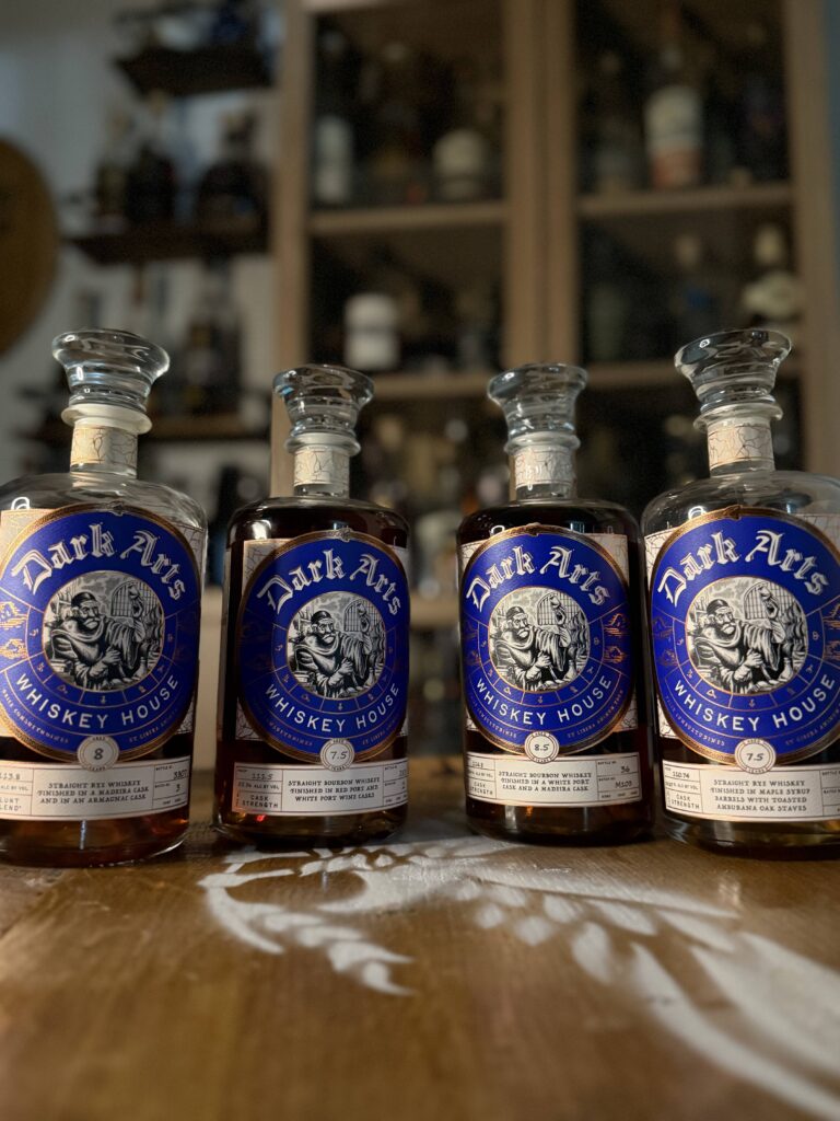 Dark Arts collection of blue label bottles