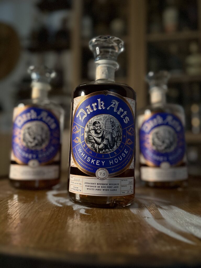Dark Arts Empyrean Vol. 2 in front of other blue label bottles