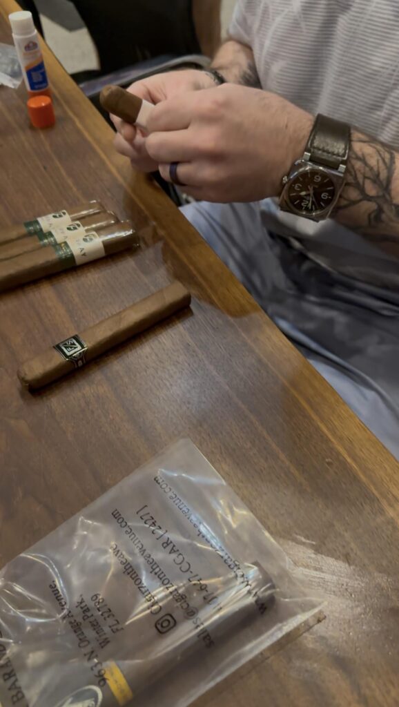 Michael hand wraps Forward/Slash cigars "because someone had to do it"