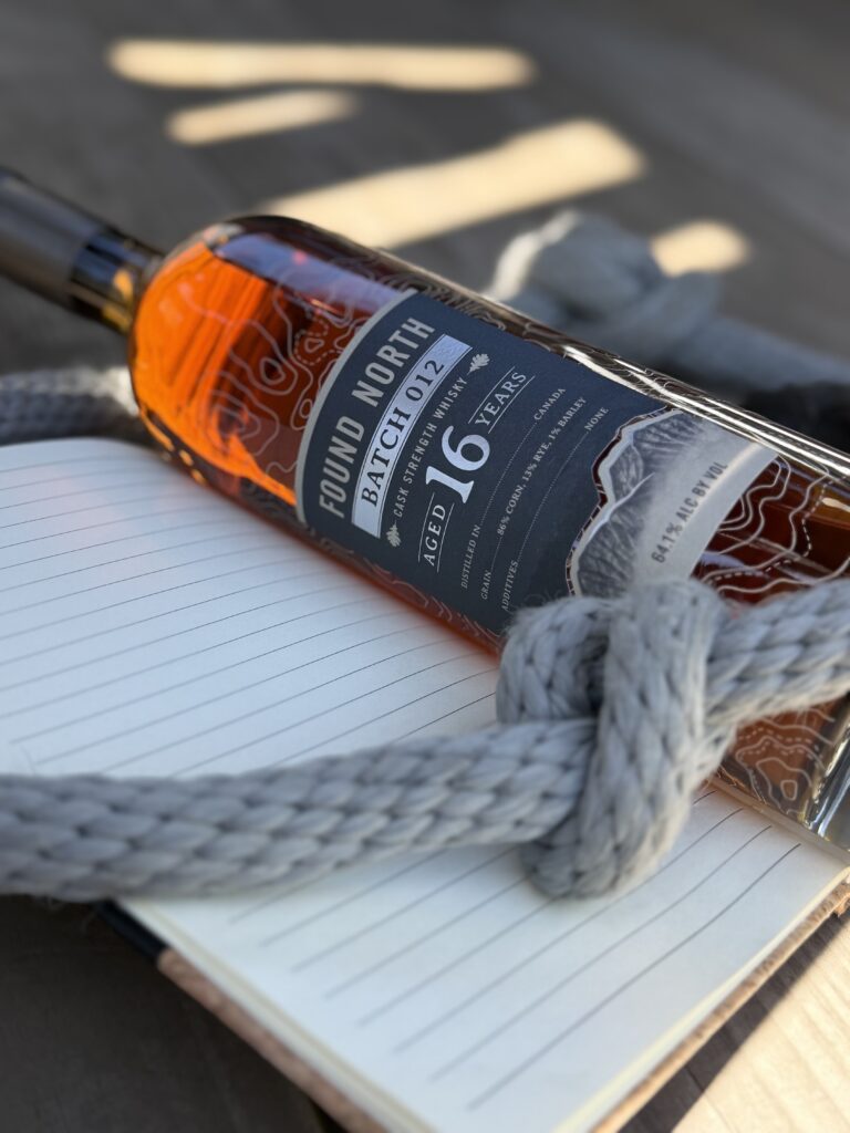 Found North Cask Strength Batch 012 lying on notebook with pen and rope