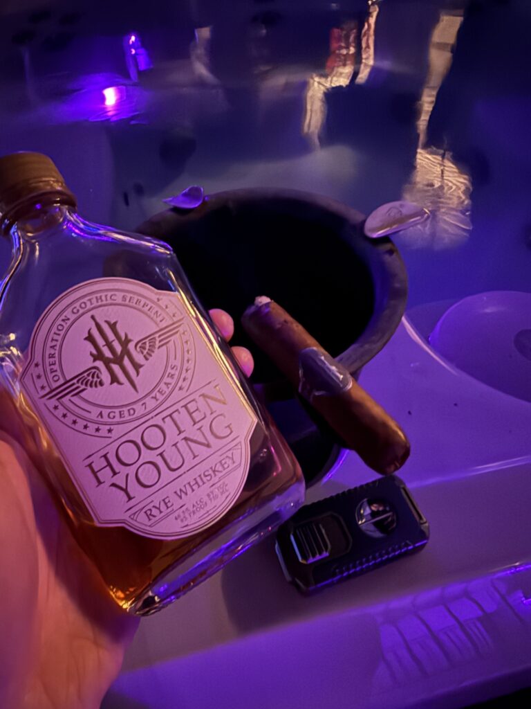 Hooten Young Gothic Serpent Rye and RTBA cigar being enjoyed in hot tub
