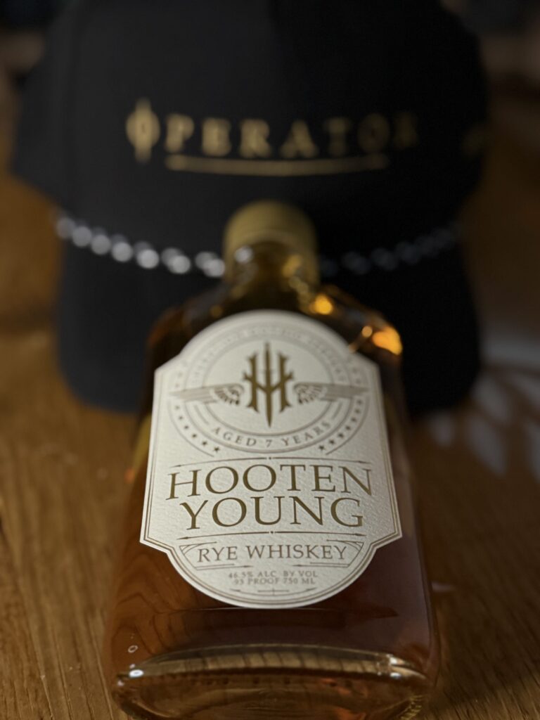 Hooten Young Gothic Serpent Rye lying against Operator hat