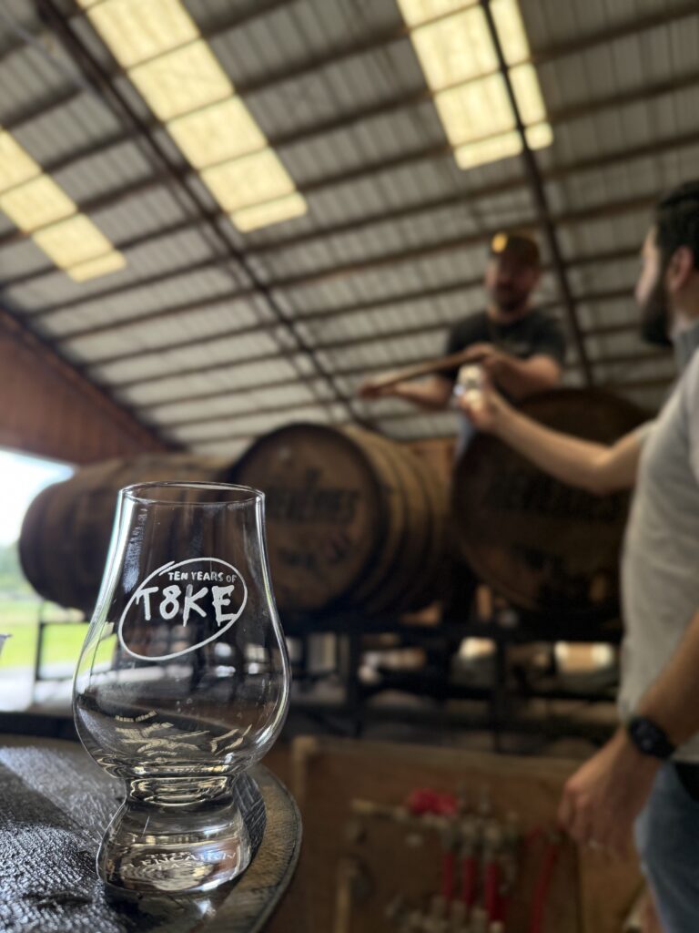 t8ke glass can be seen with blurred Jay West pouring straight from the barrel into friend David's glass for barrel pick