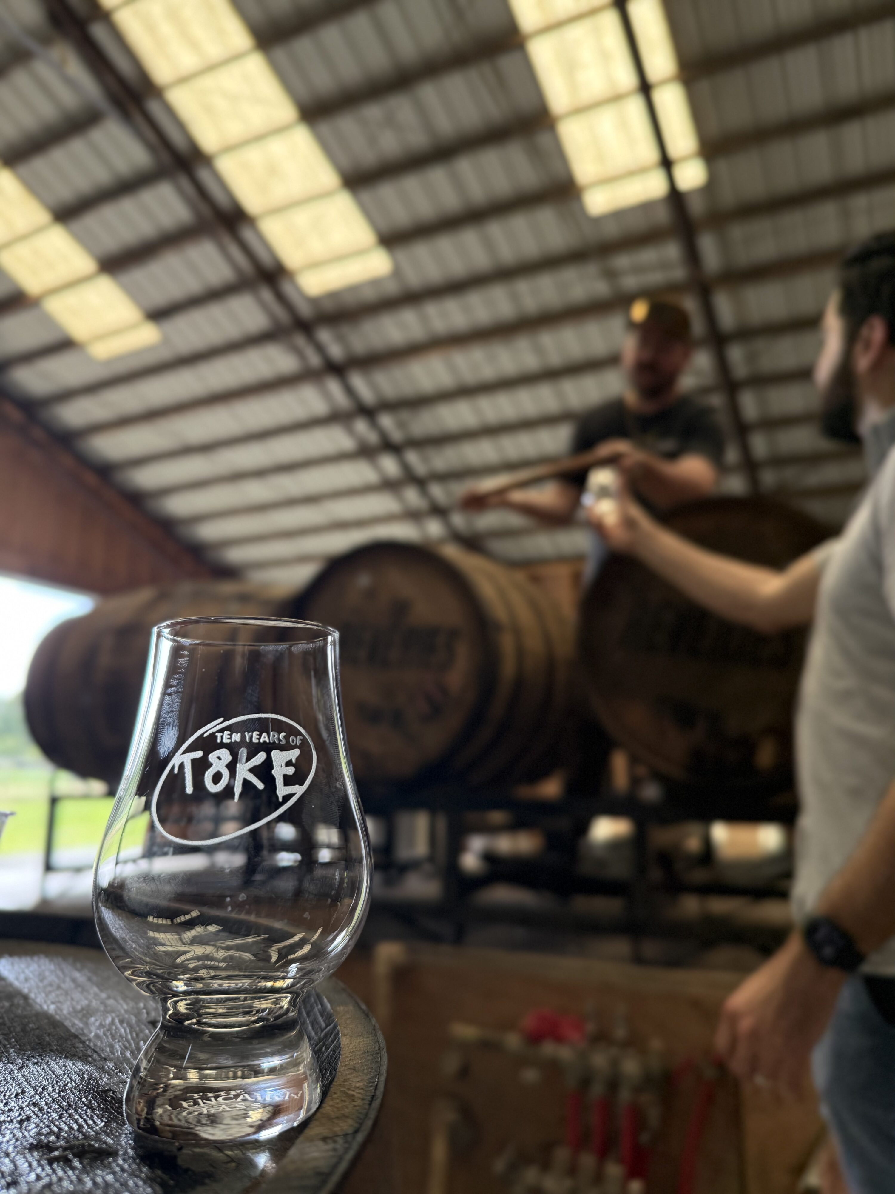 t8ke glass can be seen with blurred Jay West pouring straight from the barrel into friend David's glass for barrel pick