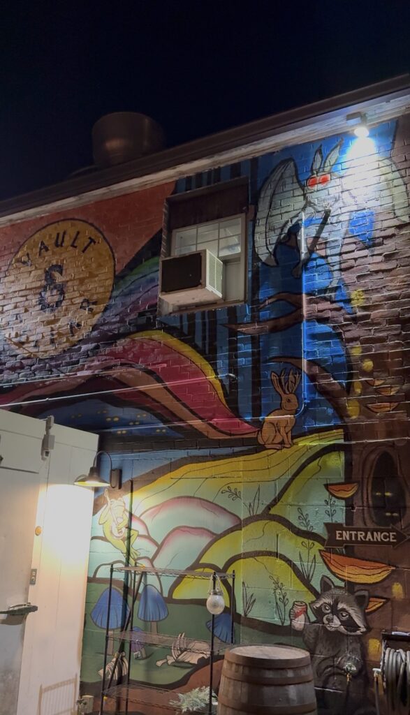 Mural on the back of Vault & Cellar where outdoor seating is located.