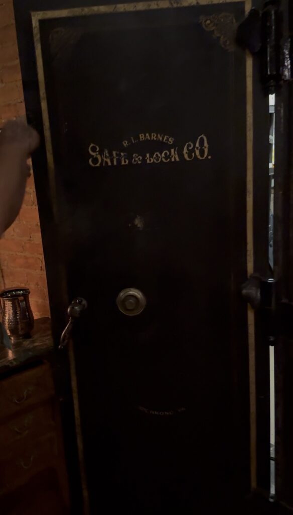 Vault & Cellar is named after the old bank that used to inhabit the building and still has the old vault door, which is now repurposed as an office and whiskey storage