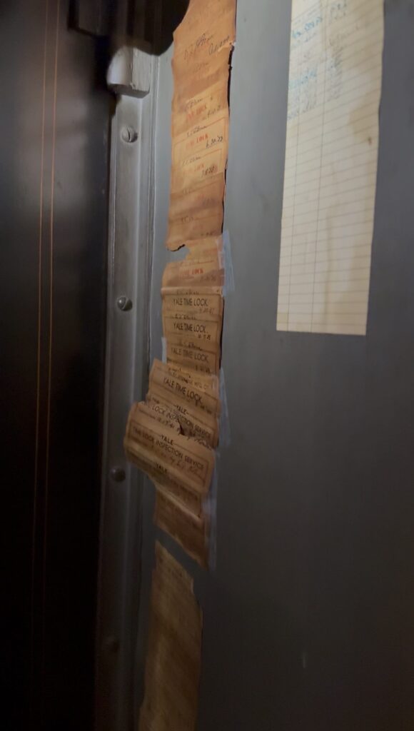 Old vault lock inspection slips can still be seen in the breaker box inside the restaurant