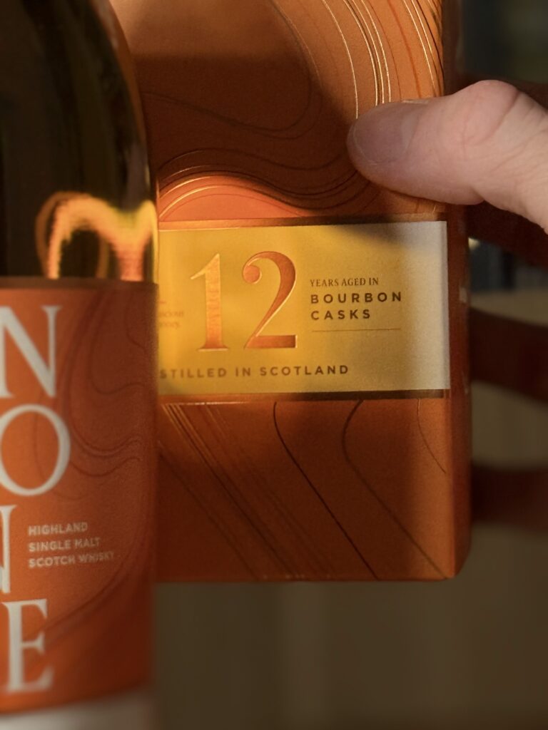 Glenmorangie "The Original" 12 Yr close-up with 12 catching glow of light through the whiskey