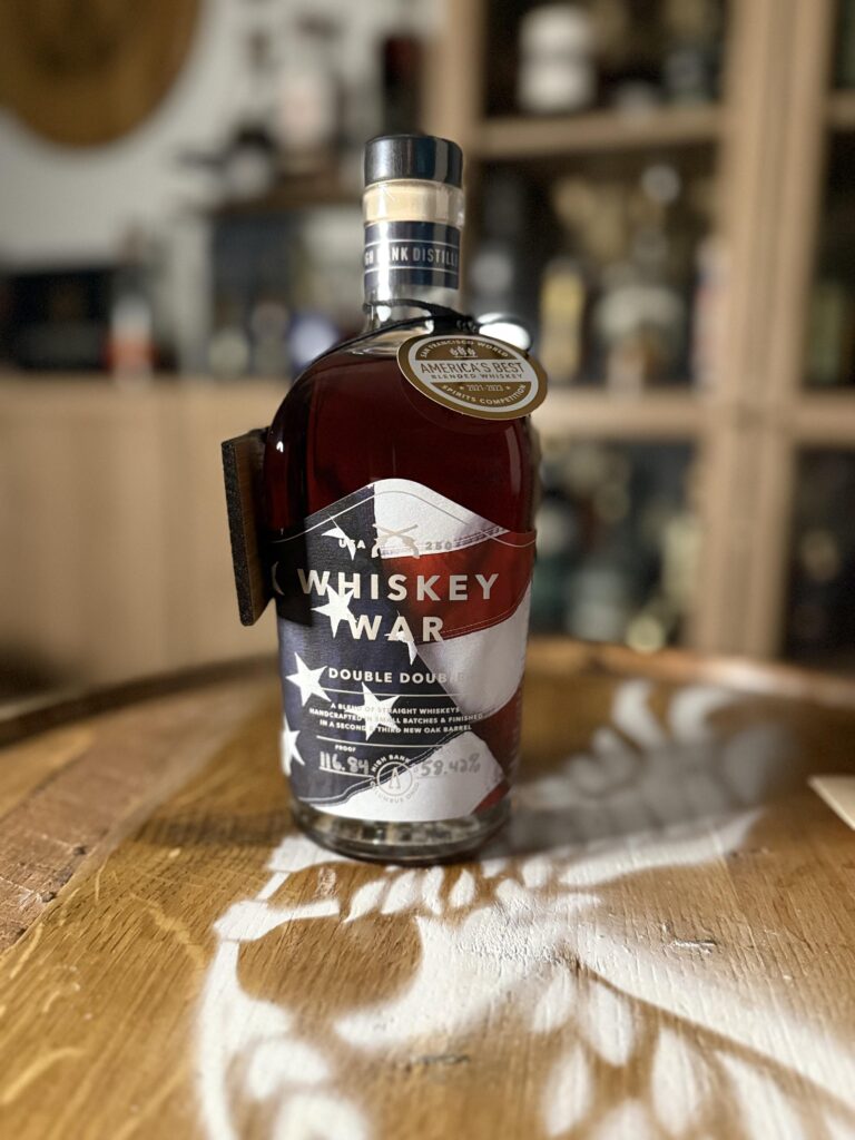 High Banks Whiskey War Double Double Oak 250th Anniversary Release in front of whiskey collection