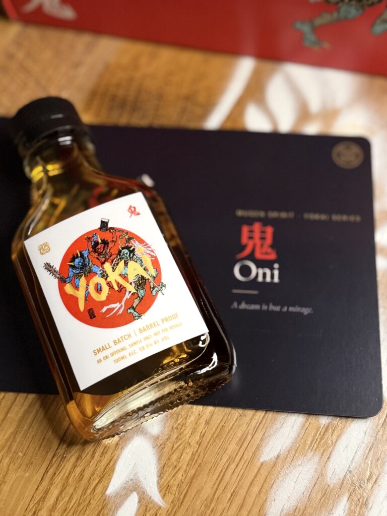Mugen Oni Barrel Proof Small Batch sample lying on Oni card