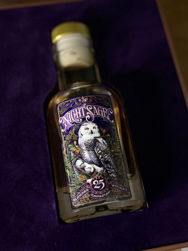 Orphan Barrel Night Sage 25 Yr Blended Canadian Whisky bottle lies in purple velvet box