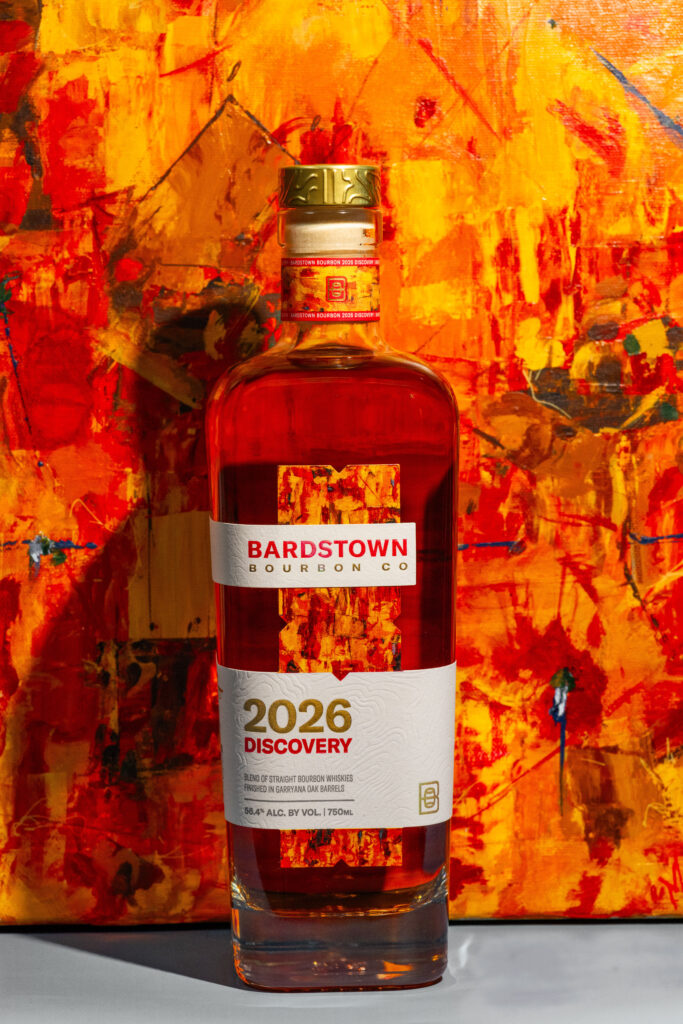 Bardstown Bourbon Company 2026 Discovery stands against its full-size custom artwork by Louisville artist Margaret Archambault